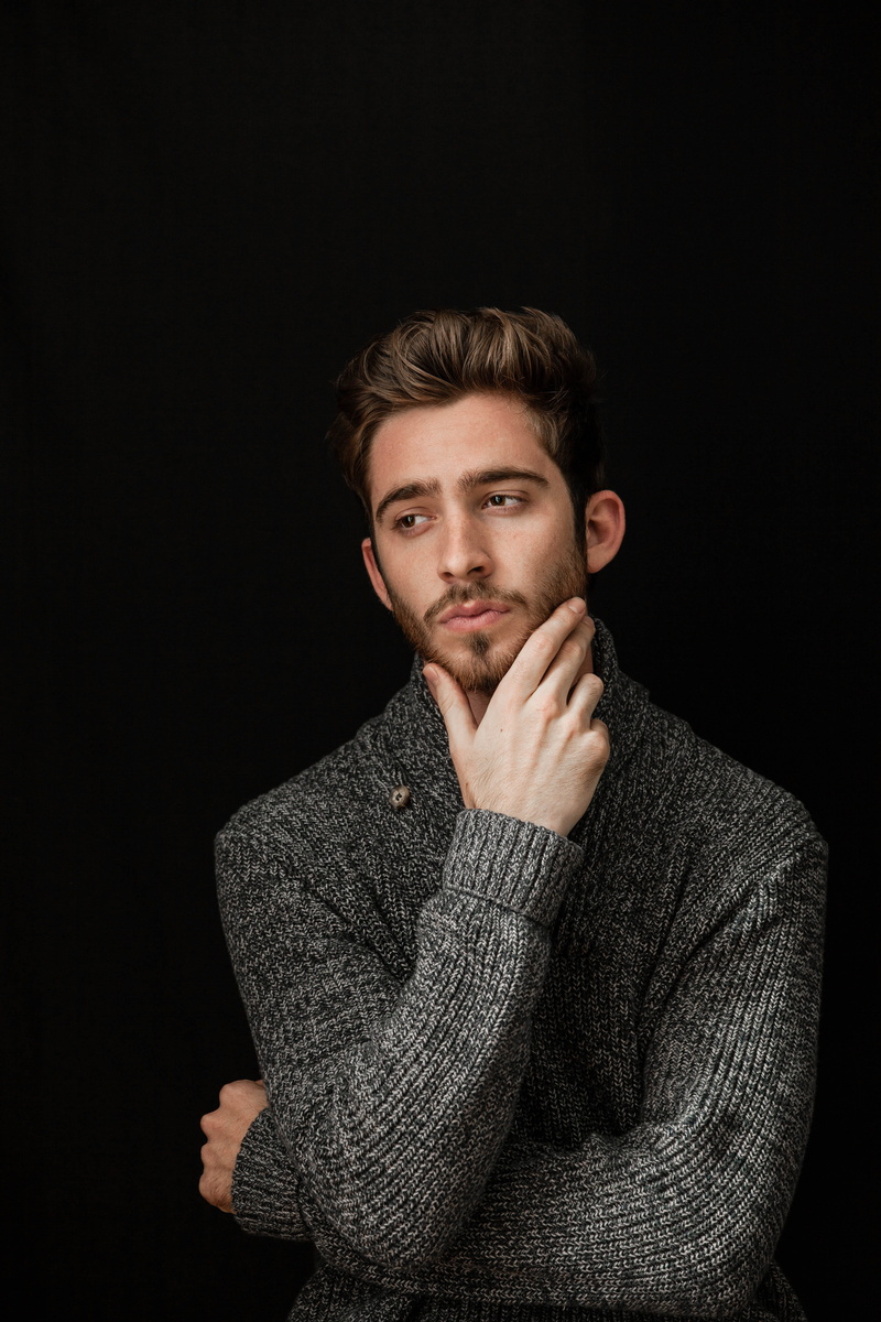 hairstyle, chin, long, adult, facial hair, young men, knit, waist up, wisdom, wise, headshot, black background, indoors, portrait, sleeved, looking at camera
