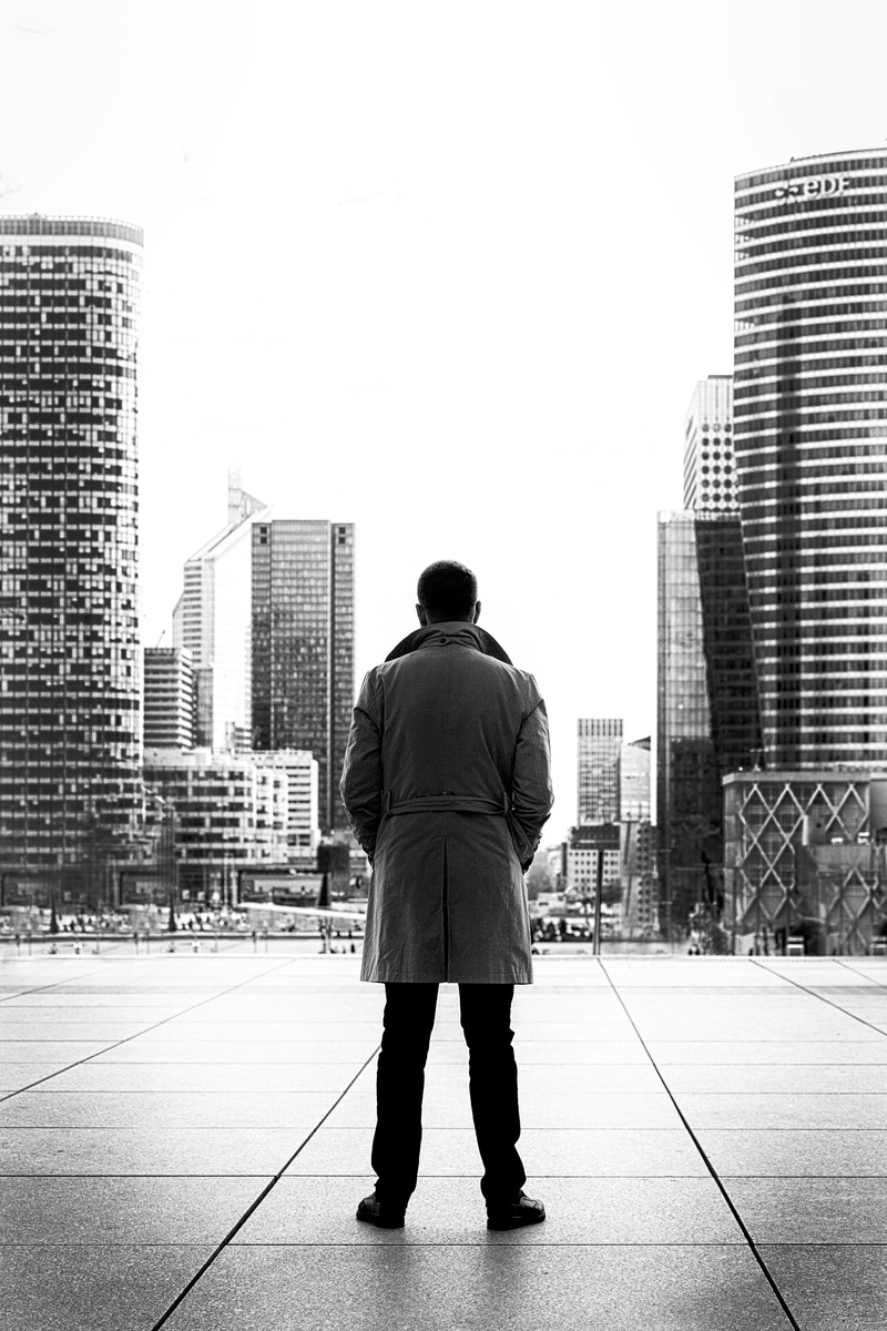 back view, built structure, man, building exterior, wearing, day, perspective, real people, office building exterior, wear, architecture, person, coat
