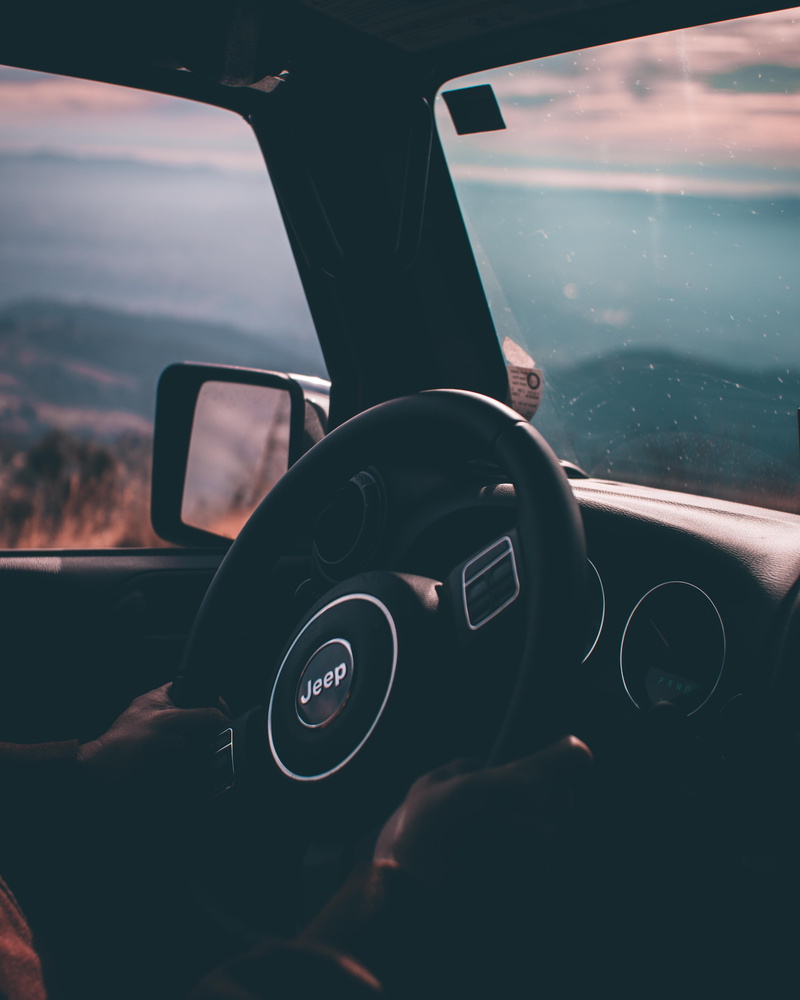 windshield, airplane, usa, vehicle interior, close-up, jeep, person, travel, human, car interior, hand, indoors, car, transportation, holding, vehicle