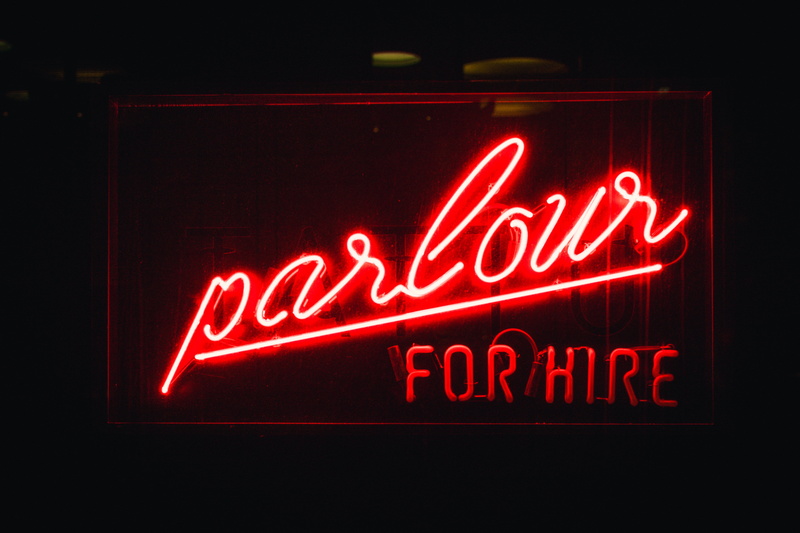 black background, indoors, open sign, no people, parlour, neon, dark, hire, 5K, western script, text, signage, red, neon Light, close-up, lights, store