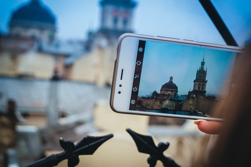focus on foreground, mobilephone, water, tourism, girl, communication, finger, center, building, reflection, travel destinations, lviv, friend, architecture