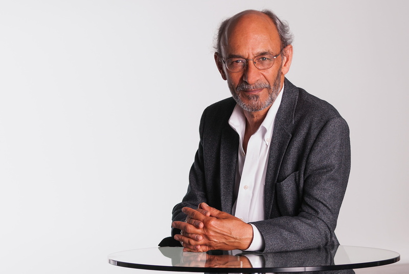 one person, white shirt, businessman, mature adult, beard, mature men, clear, confidence, folding hands, suit, balding, eyeglasses, glasses, thin, waist up