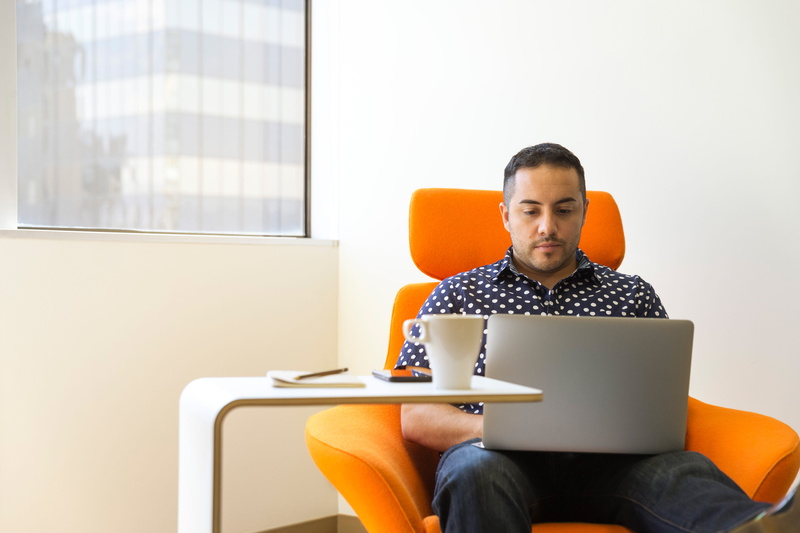 wooden, three quarter length, silver, mug, laptop, men, furniture, wearing, modern, polka, working, blue, sales pro, armchair, orange, 5K, adult, dot