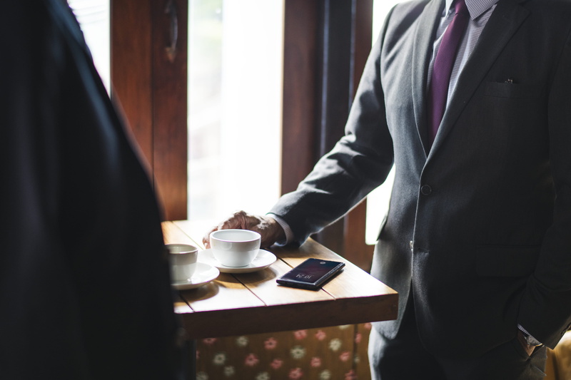 standing, coffee shop, modern, formal, table, communication, two people, well-dressed, wall, break, people, beside, two, room, suit, employee, coffee - drink