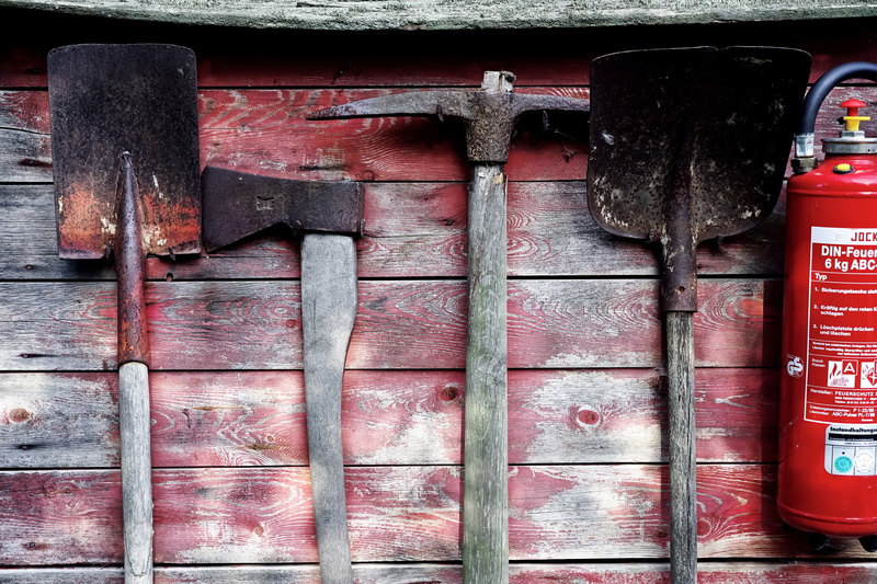 a fire extinguisher, fire shield, axe, 2K, shovel