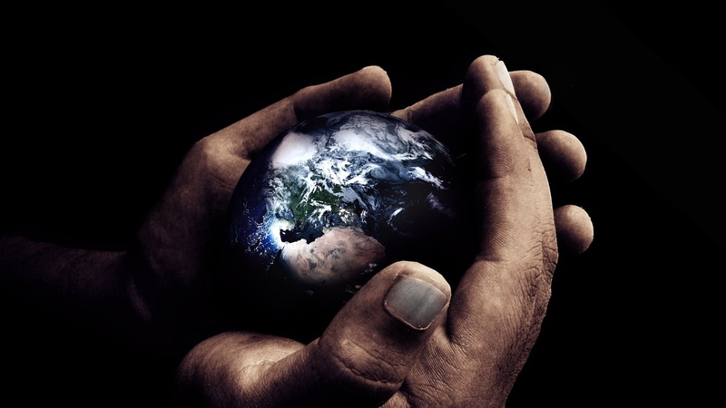 indoors, hands cupped, black background, globe - man made object, nature, planet - space, hands, close-up, jewelry, care, crystal, model, security, sphere