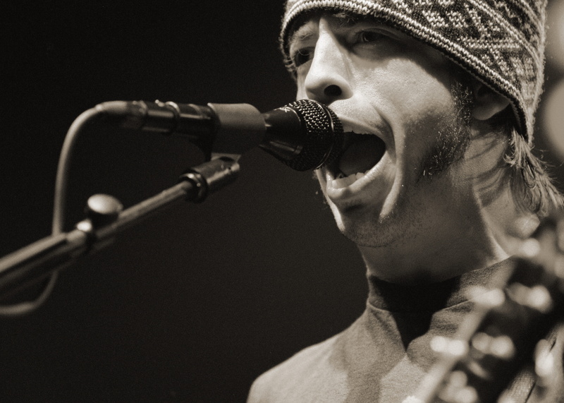 performance, studio, one person, arts culture and entertainment, headshot, recording studio, grayscale, foo fighters, music, singer, black background, talking