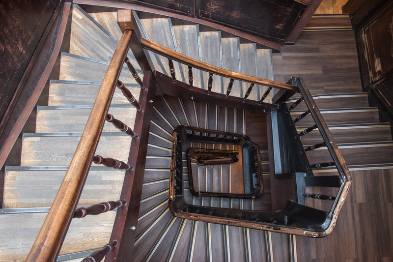 directly above, railing, spiral staircase, absence, ukraine, wooden, lviv handmade chocolate, wood - material, spiral, built structure, wood, stairs, banister
