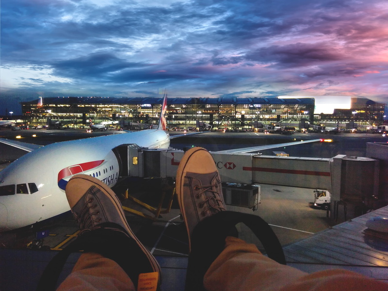 wearing, london, light, real people, outdoors, architecture, transportation system, shoes, cloud - sky, landscape, nature, shoe, low section, aviation