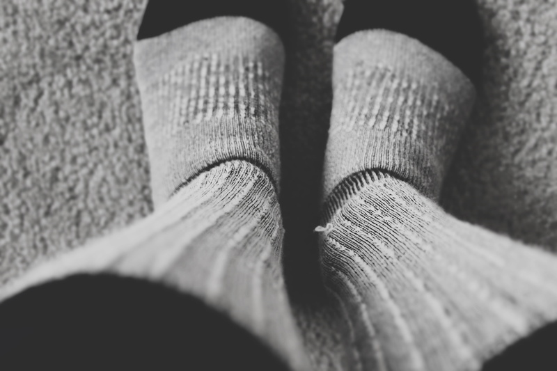 textured, man, real people, lifestyles, wearing, carpet, body part, grayscale, still, low section, legs, close-up, black and white, socks, pair, jeans