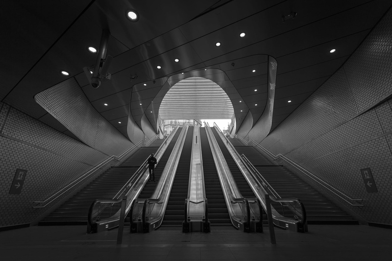 grayscale, person, down, indoors, city, built structure, technology, the way forward, railing, architecture, illuminated, ceiling, exit, underground, futuristic
