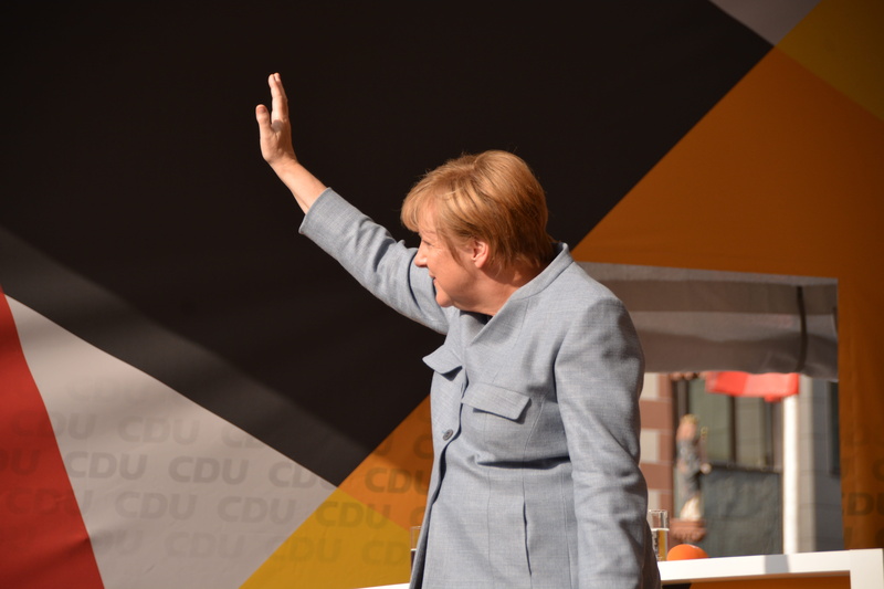 mature adult, business, well-dressed, cdu, demokratie, hand raised, human arm, body part, arms raised, gesturing, adult, human body part, hairstyle, positive emotion