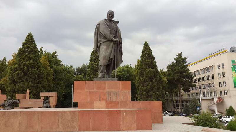 tajikistan, statue, sculpture, building exterior, building, representation, tree, built structure, human representation, cloud - sky, no people, outdoors
