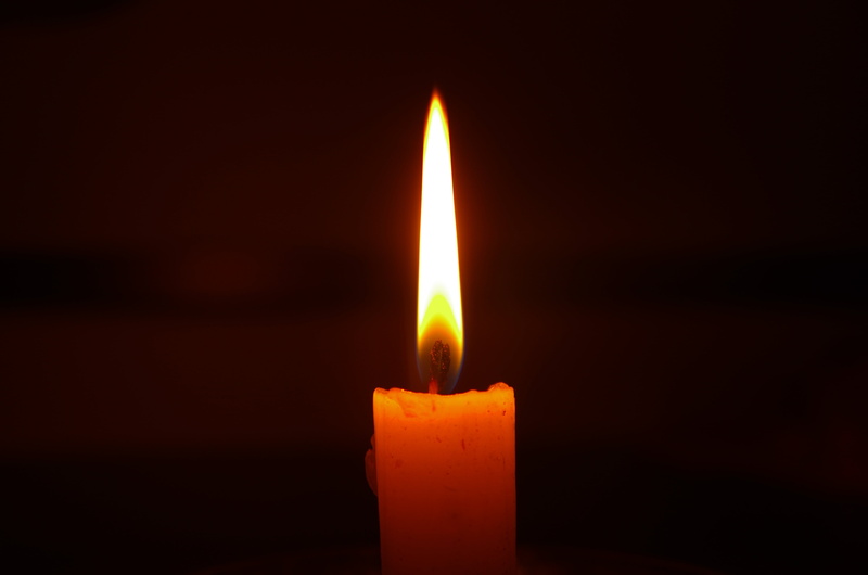 studio shot, nature, heat - temperature, luminosity, fire - Natural Phenomenon, indoors, dark, candle, religion, black background, wax, orange color, copy space