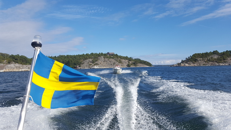 sea, sky, water, boat, nautical vessel, the stockholm archipelago, outdoors, motion, splashing, day, archipelago, motor boat, wake - water, flag, blue