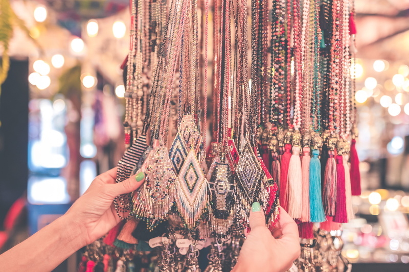 tassels, buying, choice, lifestyles, market, pick, customer, indoors, person, close-up, sale, girl, market stall, urban, outdoors, store, hanging, focus on foreground