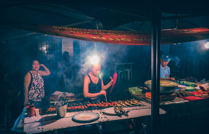 taboan public market, men, illuminated, club dj, real people, lifestyles, indoors, enjoyment, smoke - physical structure, people, philippines, adult, music