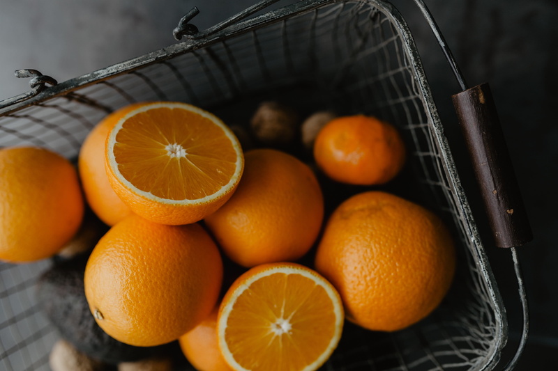 studio shot, no people, healthy eating, food, healthy, orange color, slice, vitamin c, cross section, freshness, indoors, container, wellbeing, 5K, close-up