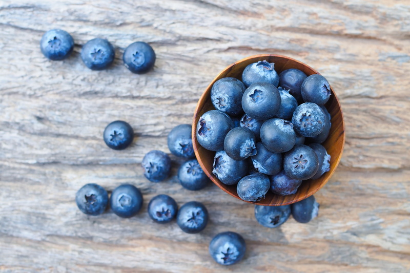 large group of objects, fruit, black color, no people, antioxidant, high angle view, food, directly above, wellbeing, healthy eating, berry fruit, still life