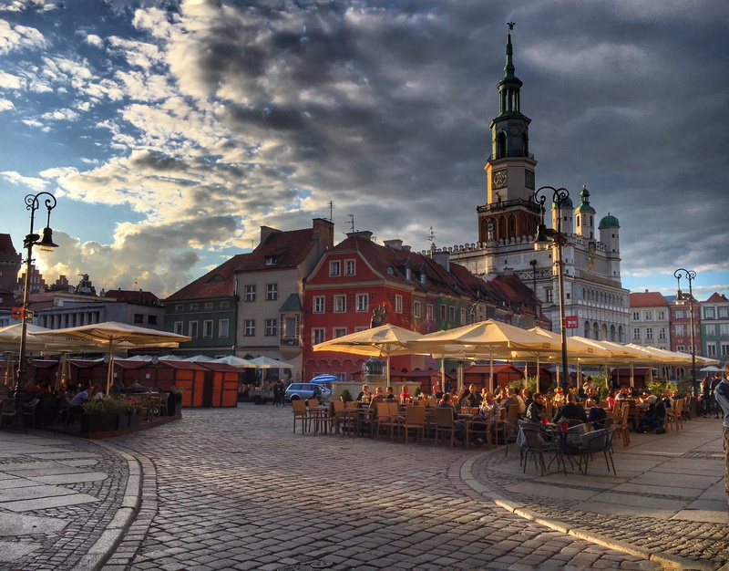 incidental people, history, group, cobblestone, cafe, cloud - sky, town, adult, poznan, the market, building, holidays, restaurant, group of people, street