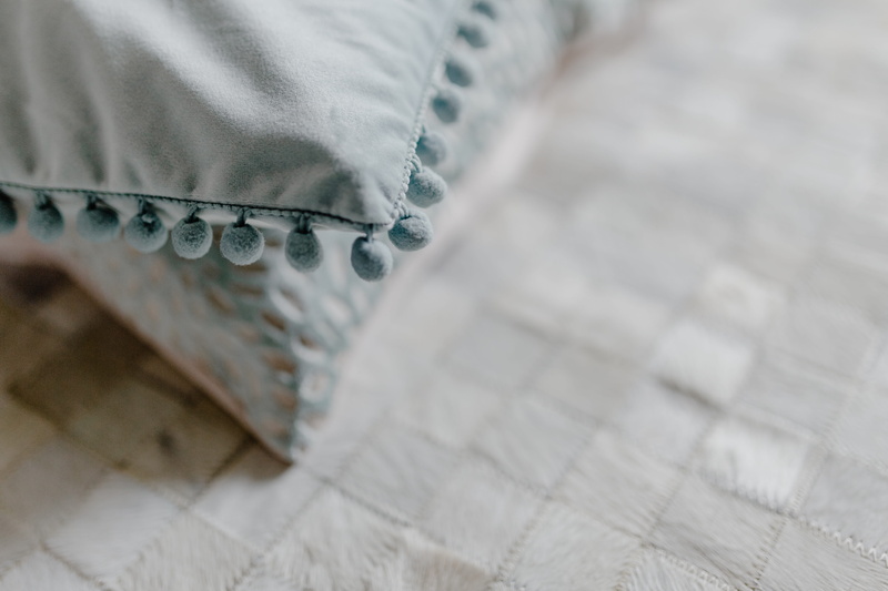flooring, indoors, home, high angle view, decor, casual clothing, selective focus, blue, wedding, 5K, garment, interior, sofa, white color, cozy, no people