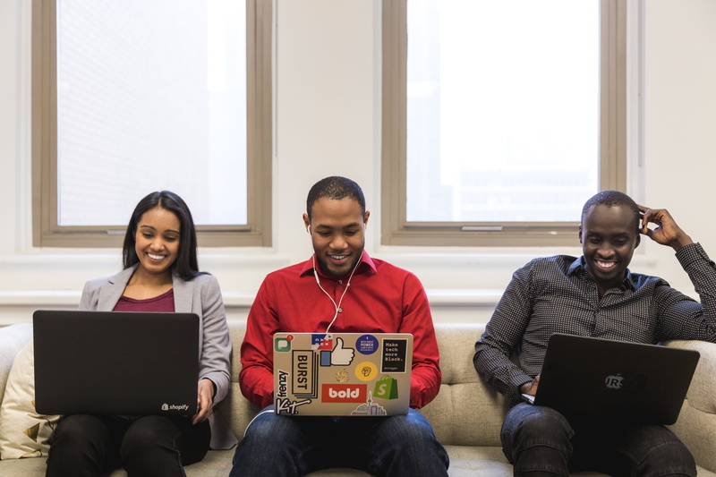 sitting, College, Startup, Team, laughing, front view, adult, indoors, communication, using laptop, Presentation, Education, Women, Business, School, technology