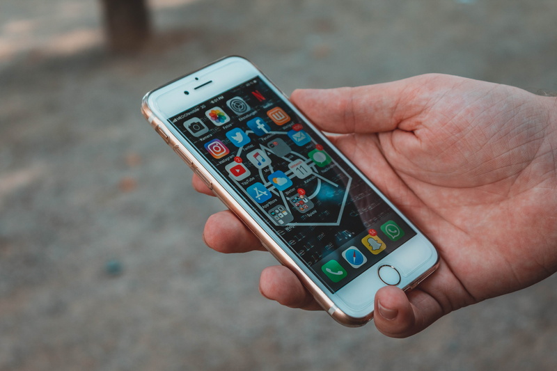 control, holding, cell phone, apps, hand, device, portable information device, smart phone, outdoors, facebook, communication, gold, wireless technology