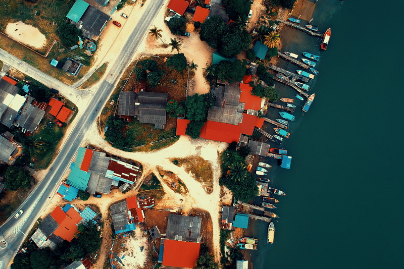 day, outdoors, transportation, building exterior, birds eye view, multiple lane highway, aerial, mode of transportation, street, vehicles, modern, houses