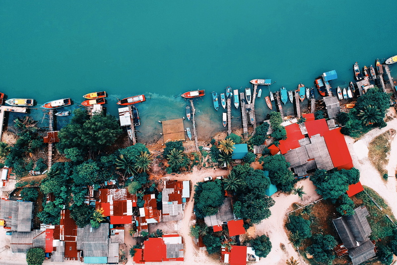 office building exterior, houses, shot, birds eye view, aerial view, streets, 4K, outdoors, boats, day, high angle view, building exterior, motor vehicle