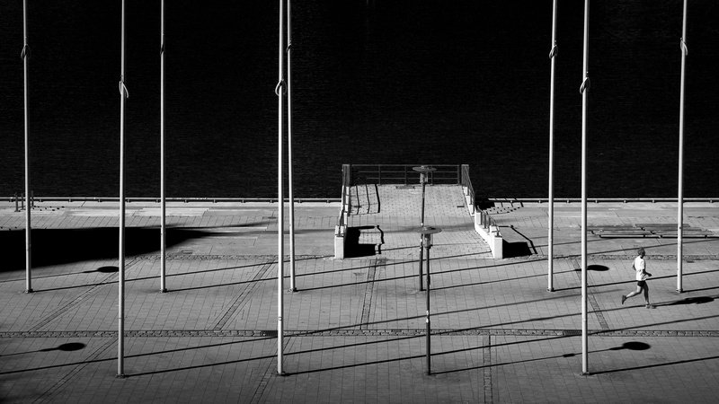 person, concrete, shadow, building exterior, banister, rod, outdoors, kiel, germany, window, transportation, jogging, photography, sport, water, city, absence