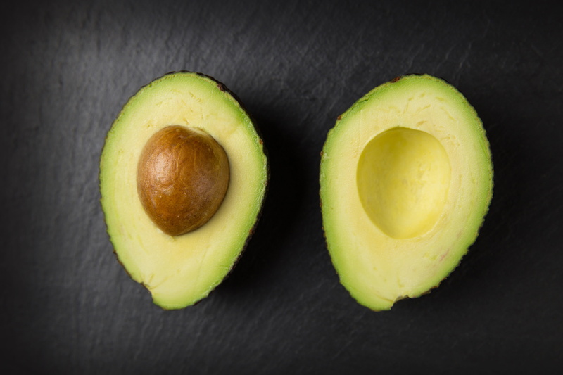 green color, no people, directly above, seed, group of objects, cross section, food, fruit, indoors, freshness, healthy food, black background, food and drink