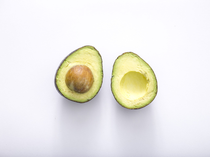 freshness, slice, food, surfaee, cross section, two objects, fruit, seed, no people, studio shot, wellbeing, yellow, snack, still life, green, indoors