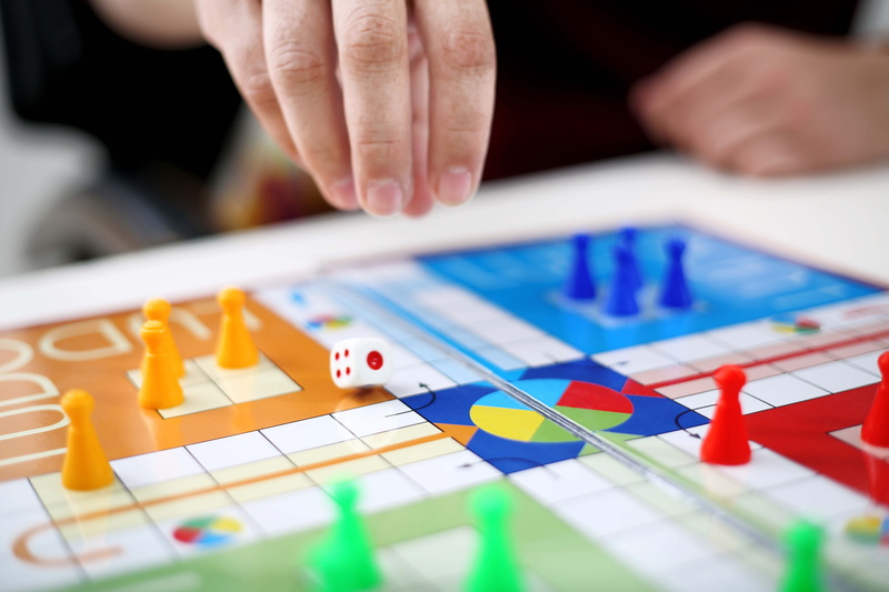 game, team, luck, skill, one person, leisure activity, man, body part, person, human hand, fun, ludo, family, cube, start, child, group, pawn, winner, table