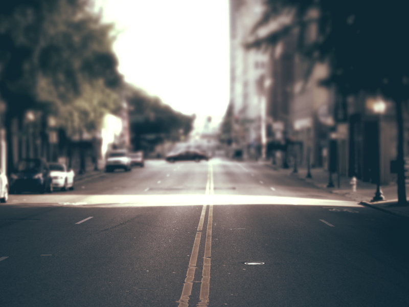 2K, architecture, blurred, road marking, direction, outdoors, city street, no people, symbol, surface level, transportation, the way forward, city, dividing line