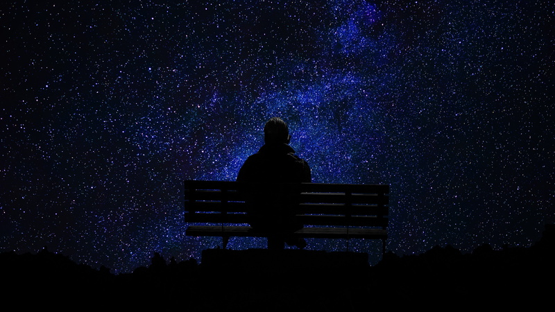easy, beauty in nature, man, milky way, leisure activity, cosmos, cosmic sky, scenics - nature, looking, bench, silhouette, space, twilight, night, astronomy