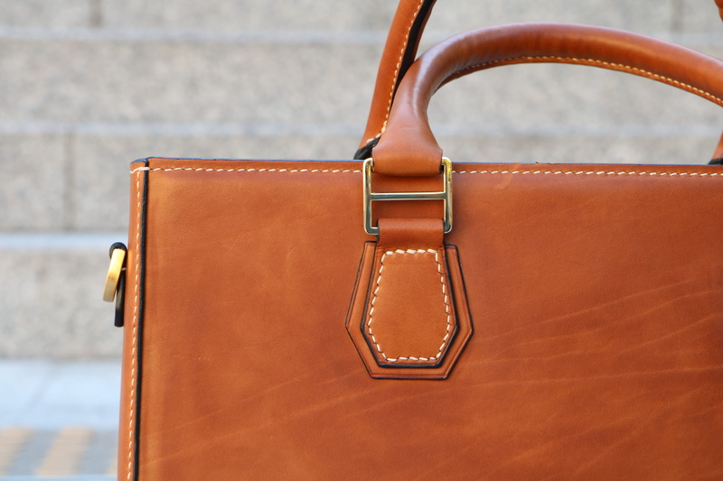 brown, hobby, luggage, style, close-up, zipper, bag, personal accessory, leather craft, handicrafts, effort, travel, fashion, qualitative, no people, focus on foreground