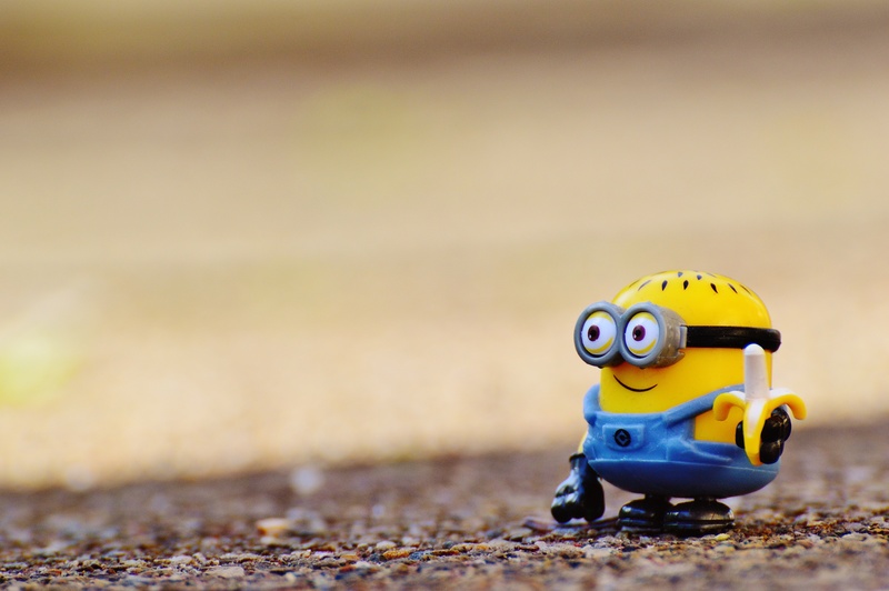 animal representation, nature, yellow, representation, daytime, children, toy, small, figure, brown, outdoors, surface, day, toy car, innocence, selective focus