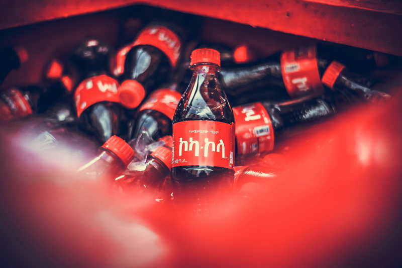 party, still life, apparel, selective focus, bottle, car, beverage, wheel, motor vehicle, communication, food and drink, beer, glass - material, indoors