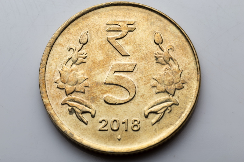 rupee, communication, studio shot, craft, finance, text, wealth, circle, western script, single object, still life, geometric shape, currency, indoors