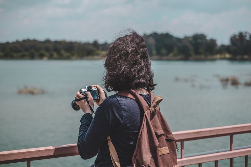 photography themes, new, women, digital camera, standing, hairstyle, looking at view, warm clothing, lake, storm, person, real people, sitting, slr camera