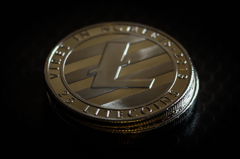 black background, business, close-up, money, personal accessory, coin, technology, photography themes, silver - metal, wealth, number, instrument of time