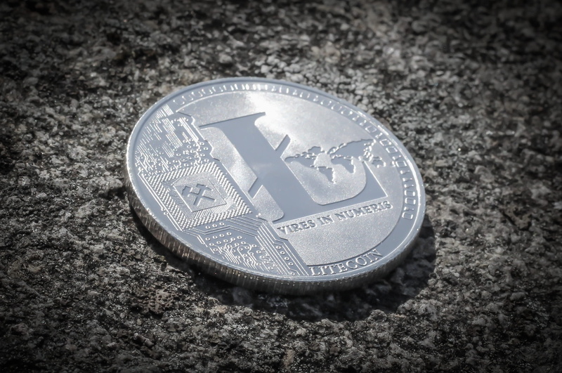 savings, no people, western script, close-up, money, geometric shape, still life, coin, care, litecoin, studio shot, text, metal, communication, economy