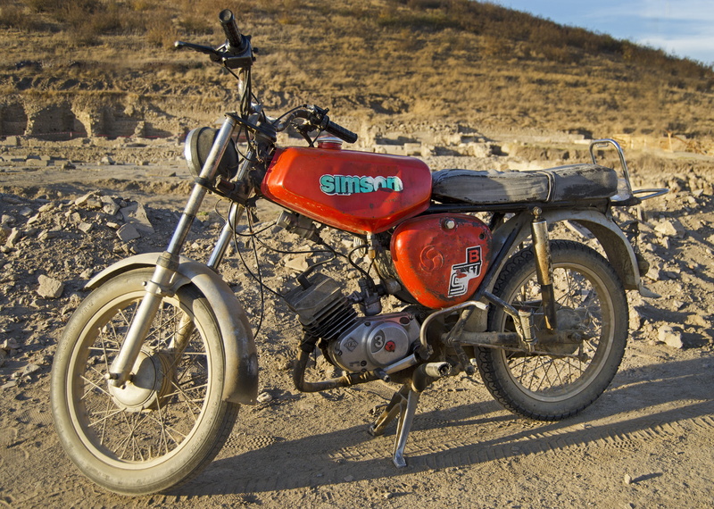 survivor, sunlight, motorcycle, road, no people, eastern block, red, communication, worn, bicycle, day, land, simson, wheel, nature, dusty, rust, outdoors