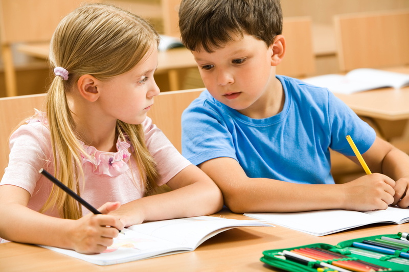 childhood, homework, lifestyles, cheating, yellow, indoors, men, smiling, elementary Age, school supplies, togetherness, table, school Building, small