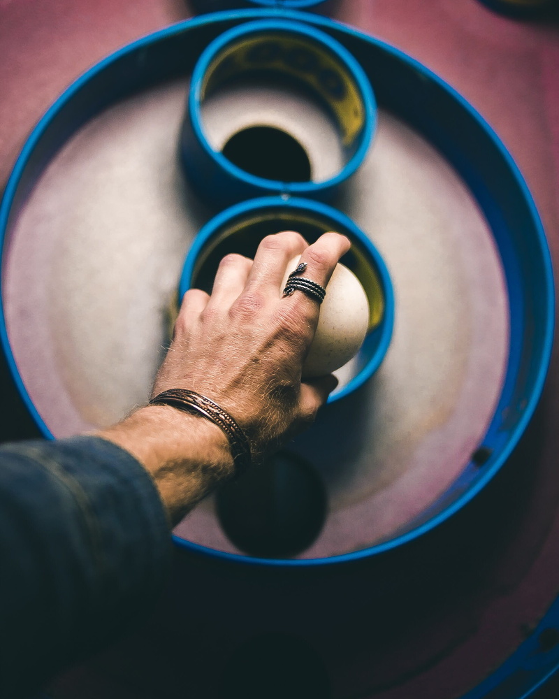 blue, human hand, person, skiball, finger, 2K, body part, lifestyles, ball, geometric shape, ski, arcade, close-up, white, high angle view, egg, musical instrument
