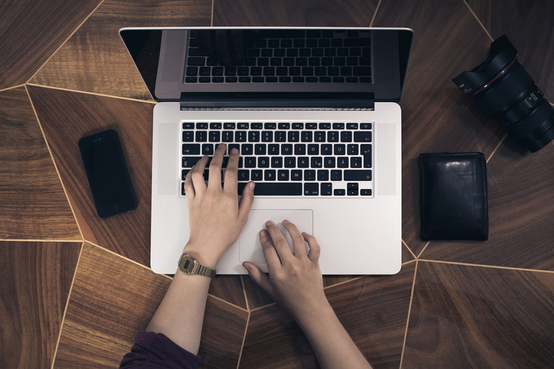 typing, 4K, using laptop, table, connection, holding, laptop, smartphone, using, wood - material, tabletop, one person, human body part, pro, wallet, communication