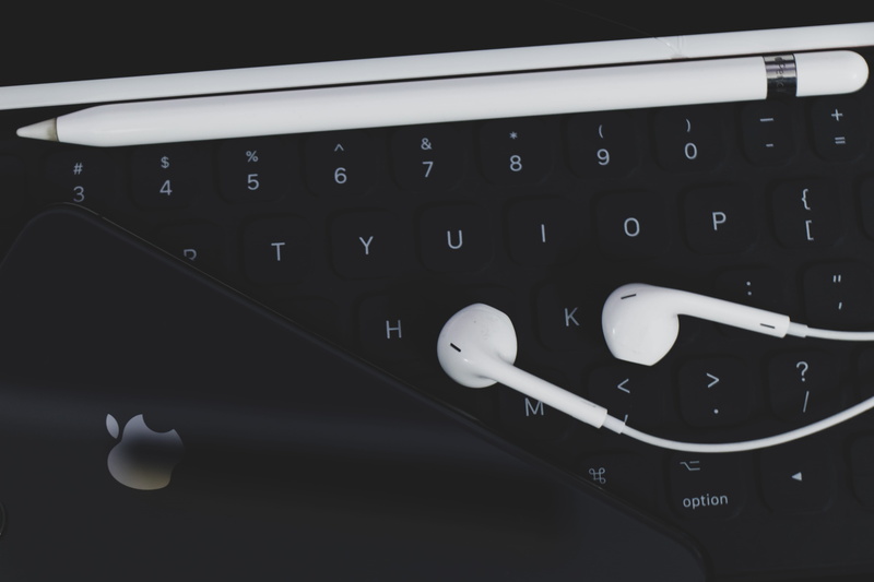 communication, computer key, iphone, corded, electronics, apple airpod, text, computer hardware, monitor, technology, black color, white, wireless technology