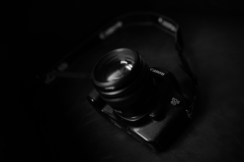 black background, canon, lens - optical instrument, page, computer keyboard, headset, black color, glass - material, photography themes, photographic equipment