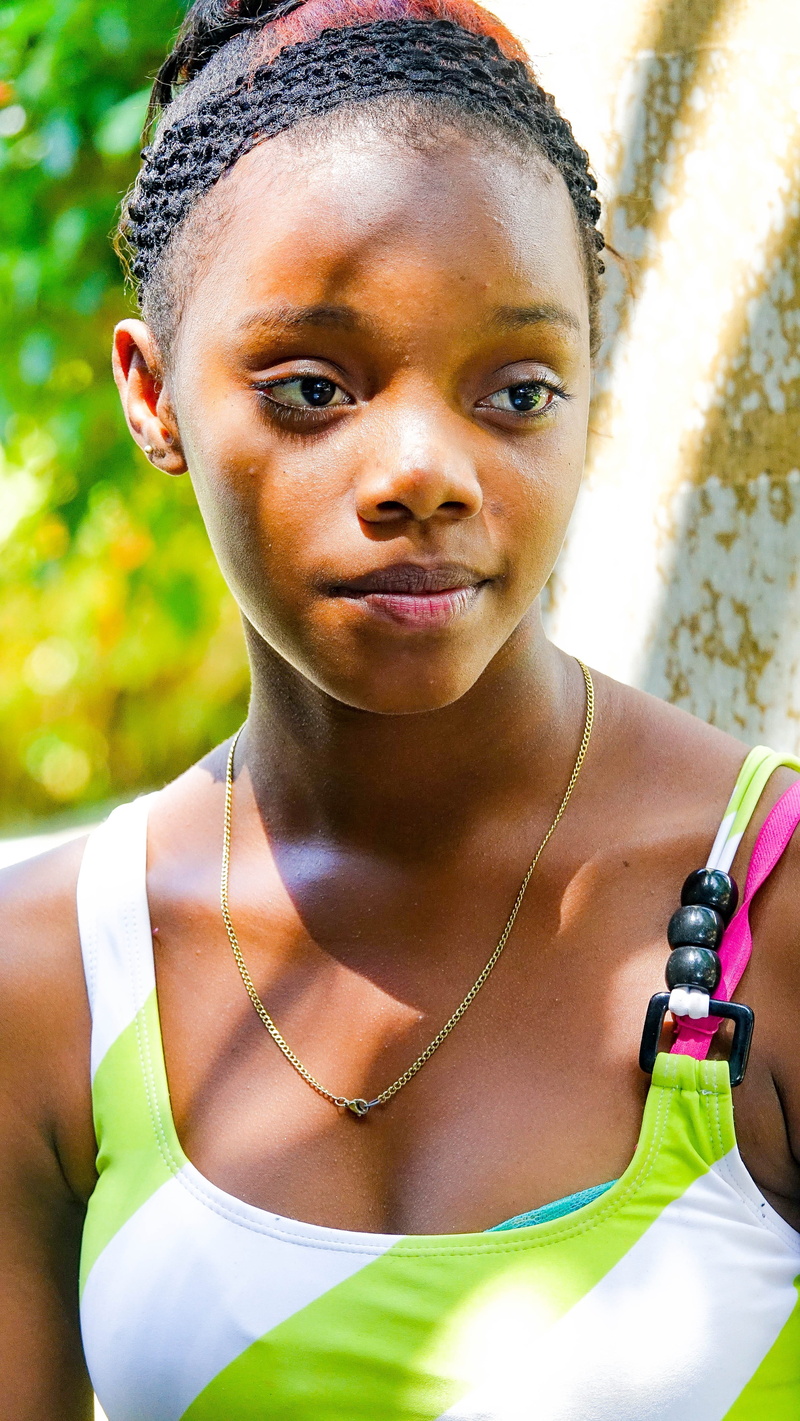 female, beautiful woman, Child, pretty, sunlight, joy, close, view, front view, lifestyles, Afro, brown, close-up, african Ethnicity, people, mouth, faces