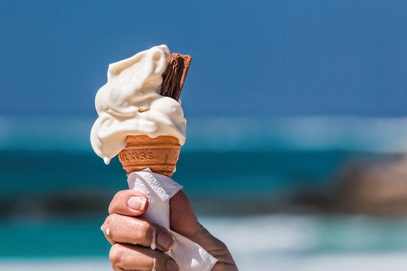junk food, cone, sea, nutrition, leisure, frozen food, sky, frozen, ice cream cone, beach, weight, human body part, cream, calorie, outdoors, refreshment